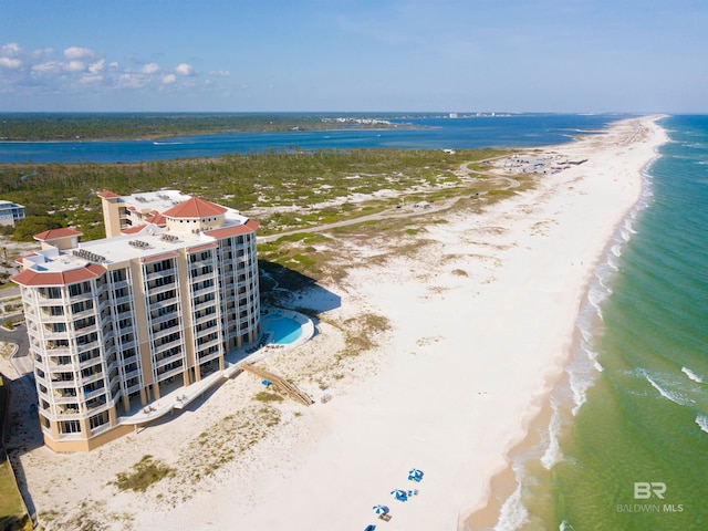 birds eye view of property featuring a view of the beach and a water view