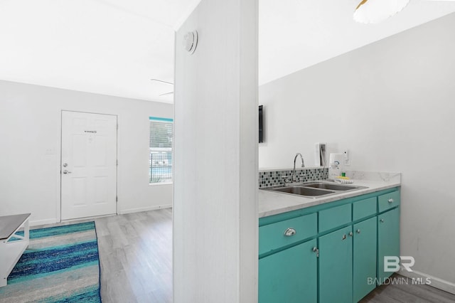 325 E 22nd Ave Unit 4, Gulf Shores, AL 36542 - interior space with a sink, baseboards, wood finished floors, and light countertops