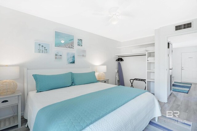 325 E 22nd Ave Unit 4, Gulf Shores, AL 36542 - bedroom with visible vents, wood finished floors, and a ceiling fan