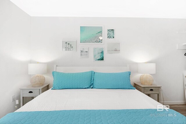 325 E 22nd Ave Unit 4, Gulf Shores, AL 36542 - bedroom with baseboards and wood finished floors