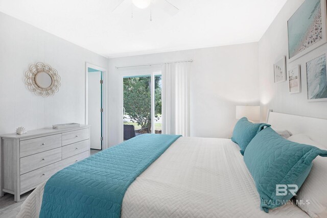 325 E 22nd Ave Unit 4, Gulf Shores, AL 36542 - bedroom with access to exterior and a ceiling fan
