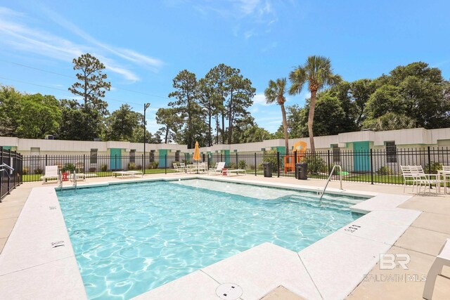 325 E 22nd Ave Unit 4, Gulf Shores, AL 36542 - pool with a patio area and fence