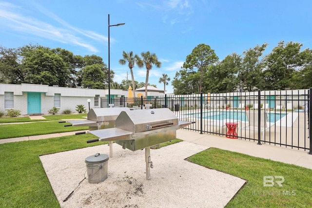 325 E 22nd Ave Unit 4, Gulf Shores, AL 36542 - view of community with a pool, a patio area, a lawn, and fence
