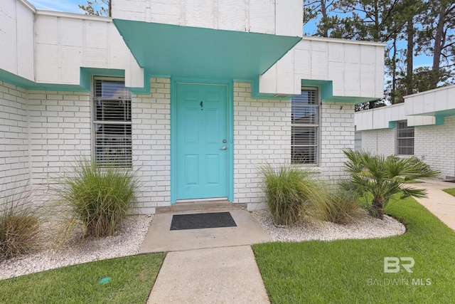325 E 22nd Ave Unit 4, Gulf Shores, AL 36542 - view of exterior entry featuring brick siding