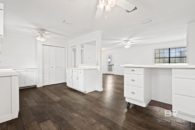 kitchen with white cabinetry, sink, dark hardwood / wood-style flooring, and ceiling fan