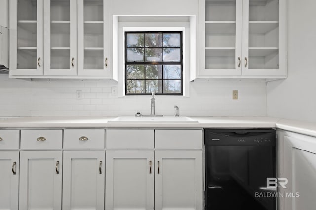 kitchen featuring white cabinetry, dishwasher, and sink