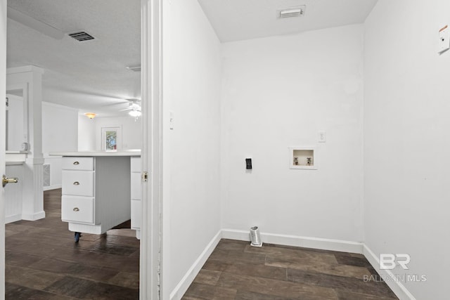 laundry area featuring ceiling fan, washer hookup, and dark hardwood / wood-style flooring