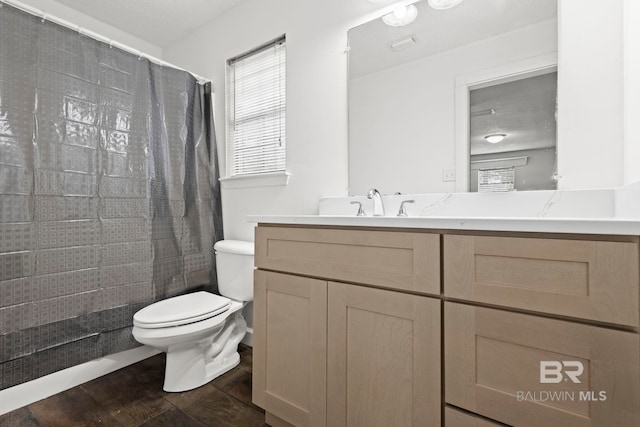 bathroom with walk in shower, vanity, toilet, and wood-type flooring