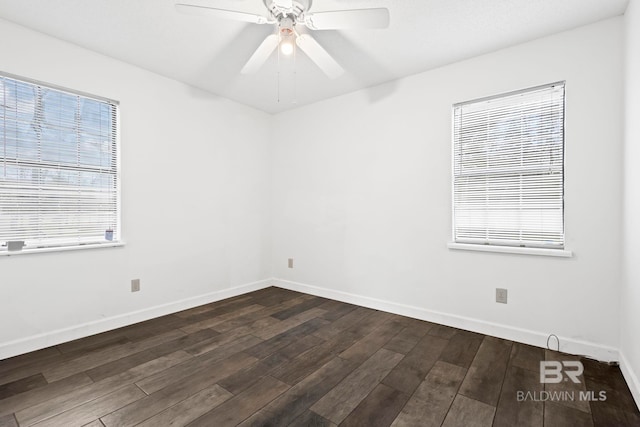 unfurnished room featuring dark wood-type flooring and ceiling fan