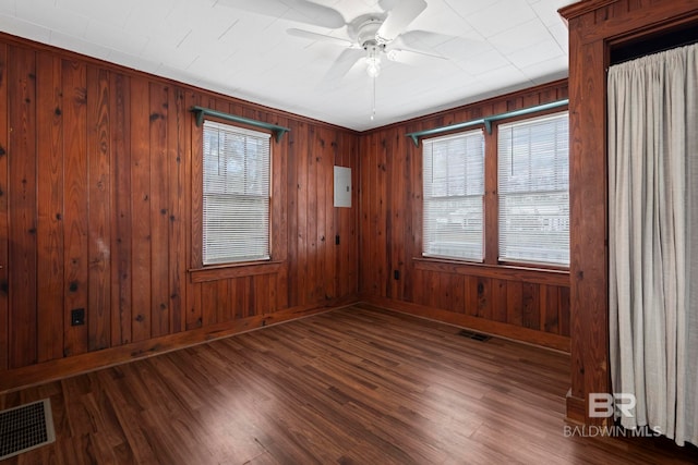 empty room with hardwood / wood-style floors and ceiling fan