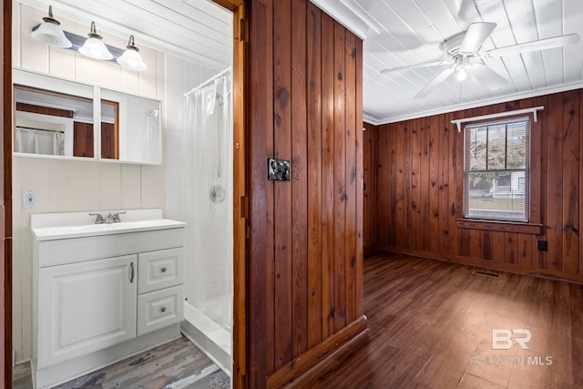 bathroom featuring hardwood / wood-style flooring, vanity, and a shower with shower curtain