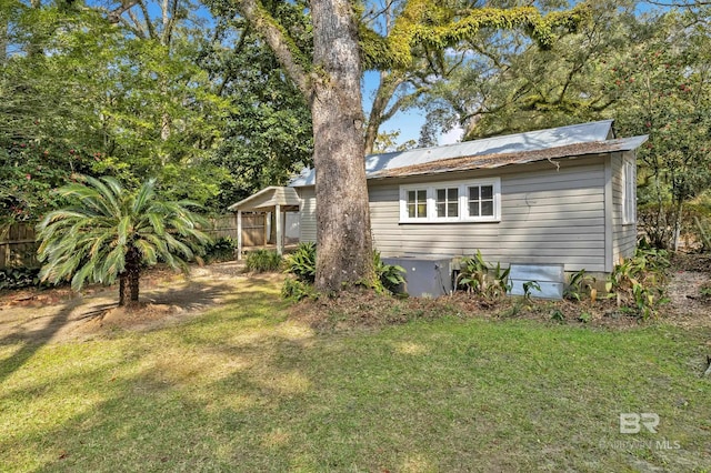exterior space featuring a yard and fence