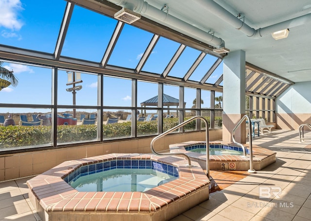 view of swimming pool featuring an indoor in ground hot tub