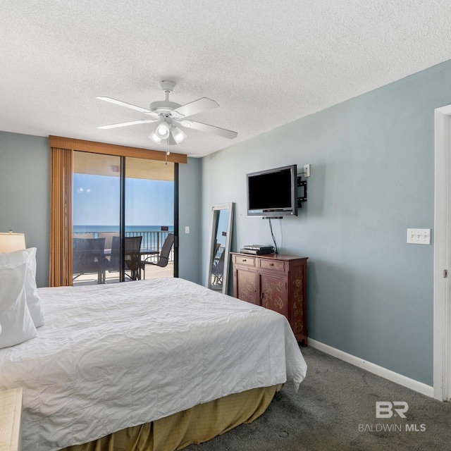 bedroom featuring a ceiling fan, baseboards, carpet floors, a textured ceiling, and access to outside