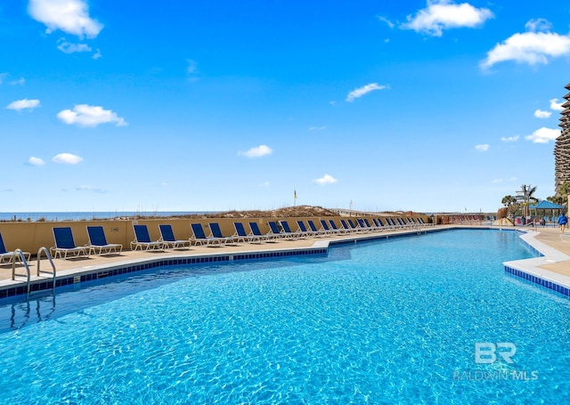 community pool featuring a patio area