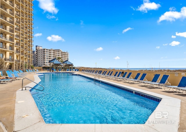 pool featuring a gazebo and a patio area