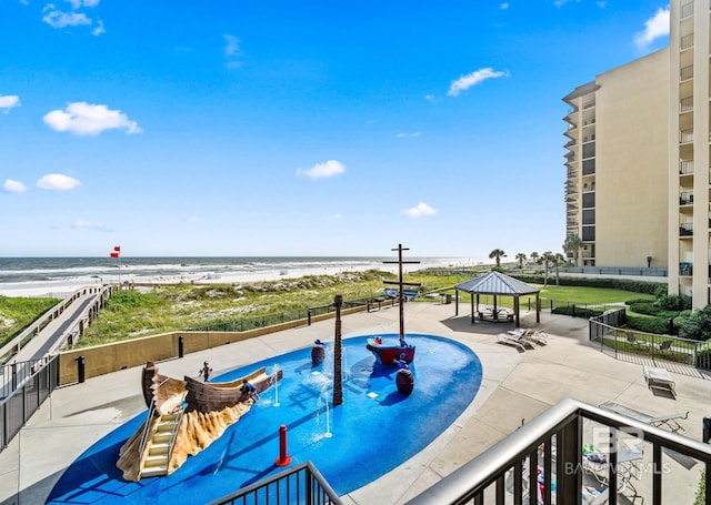 view of pool featuring a gazebo and a water view