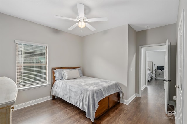 bedroom featuring ceiling fan and dark wood-type flooring