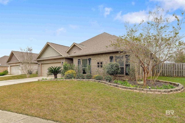 view of front of property with a garage and a front yard