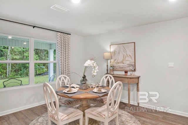 dining area featuring hardwood / wood-style flooring