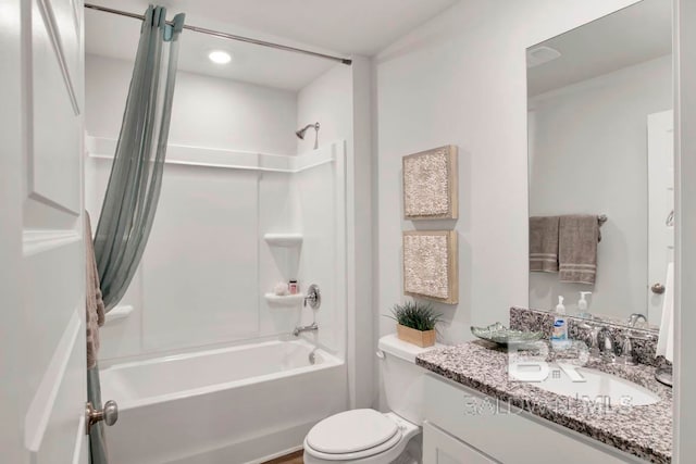 full bathroom with vanity, shower / bath combination with curtain, and toilet