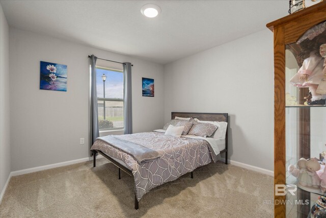 20567 Mercury Dr, Robertsdale, AL 36567 - carpeted bedroom with baseboards