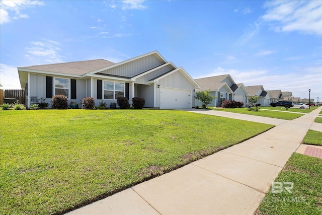 20567 Mercury Dr, Robertsdale, AL 36567 - ranch-style home featuring concrete driveway, a garage, a front lawn, and board and batten siding