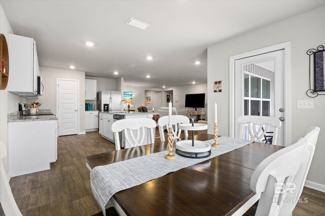 20567 Mercury Dr, Robertsdale, AL 36567 - dining space featuring dark wood finished floors and recessed lighting