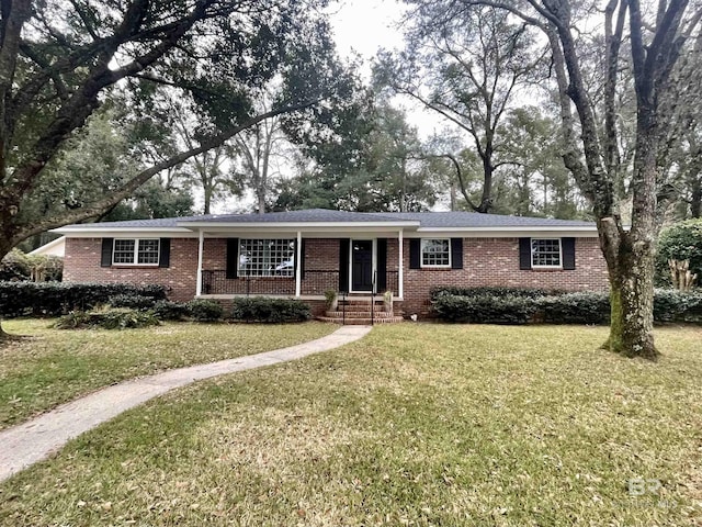 single story home with brick siding and a front lawn