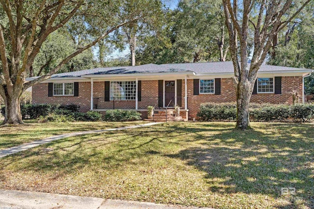 single story home featuring a front lawn and brick siding