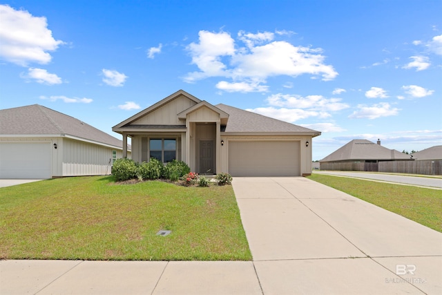 view of front of house with a garage and a front lawn