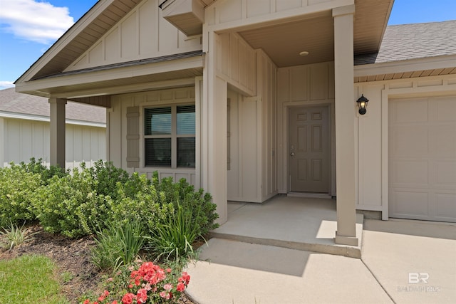 view of exterior entry featuring a garage