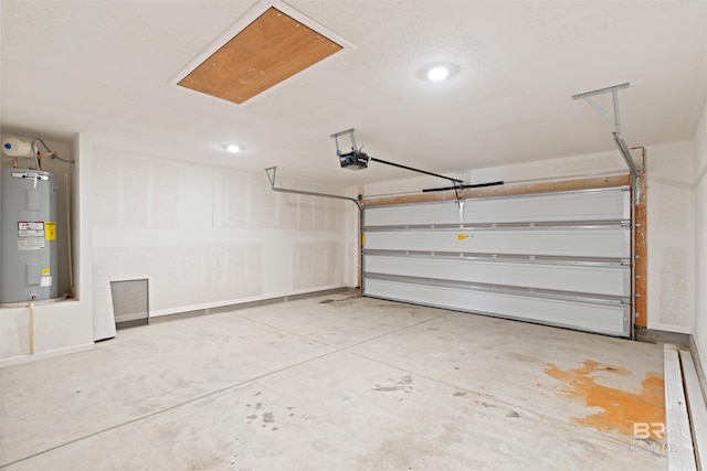 garage with a garage door opener and electric water heater