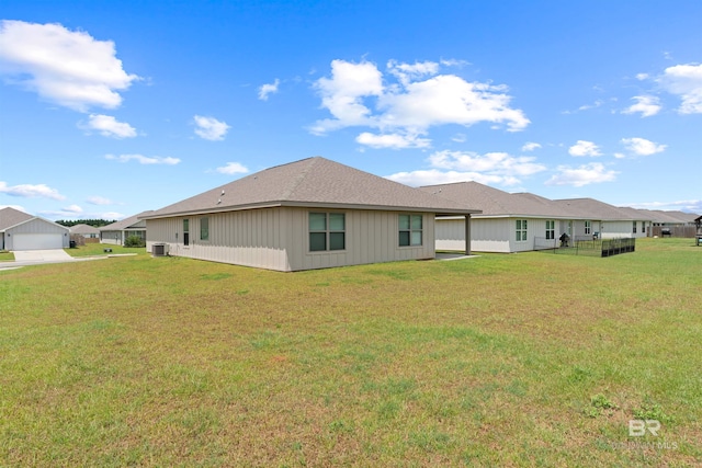 back of property with a lawn