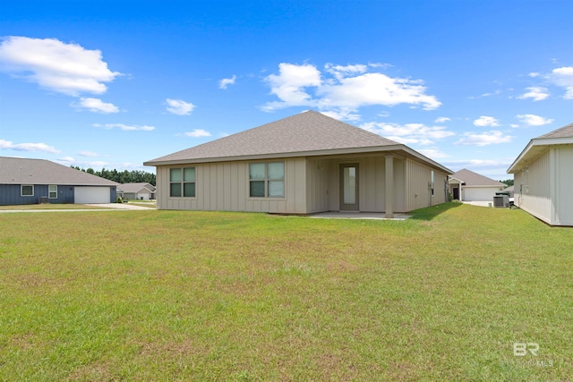 back of property with a yard