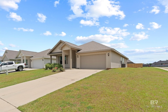 ranch-style home featuring a garage and a front lawn