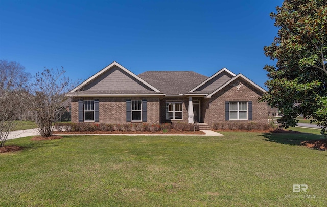 craftsman house with brick siding and a front yard