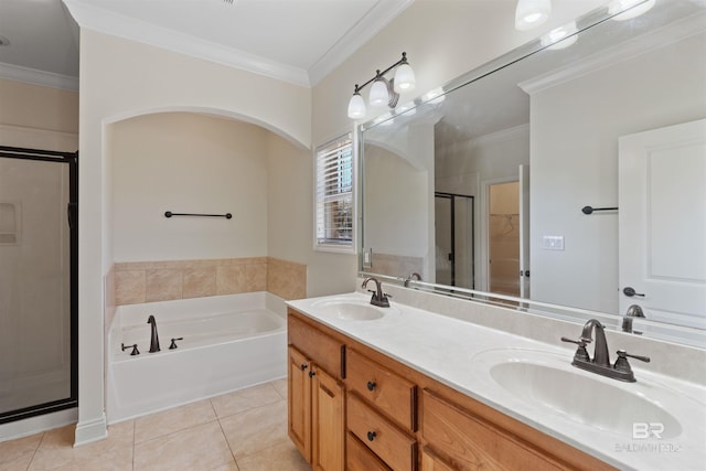 full bathroom with a sink, a shower stall, tile patterned floors, and crown molding