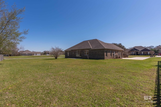 view of yard with concrete driveway