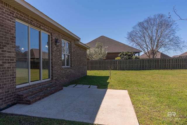 view of yard featuring a patio and a fenced backyard