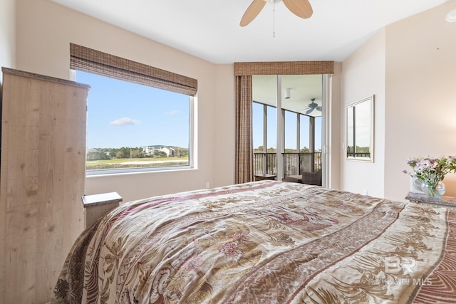 bedroom featuring multiple windows, access to outside, and ceiling fan