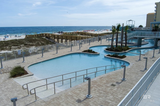 533 E Beach Blvd Unit 405, Gulf Shores, AL 36542 - community pool featuring a water view and a patio area
