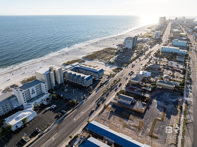 bird's eye view featuring a view of the beach and a water view