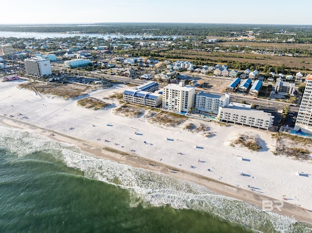 bird's eye view featuring a view of the beach and a water view