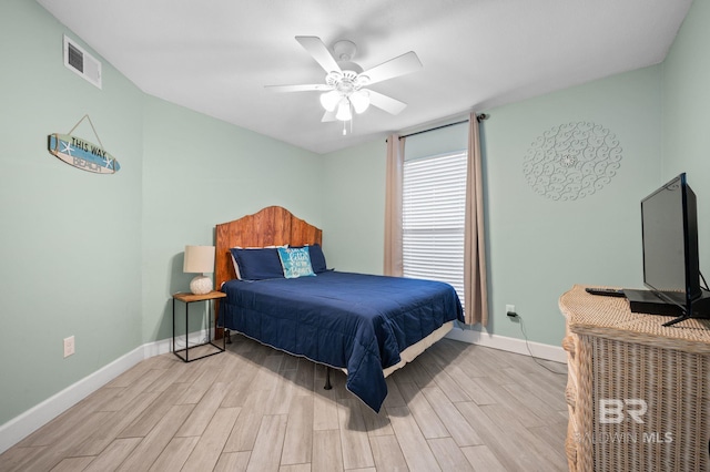 bedroom with ceiling fan and light hardwood / wood-style flooring