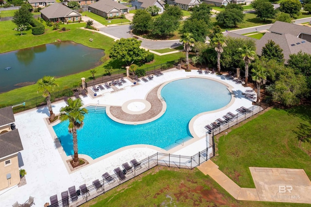 view of swimming pool featuring a water view