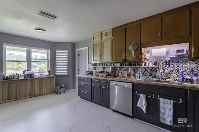 48851 Colt Run, Bay Minette, AL 36507 - kitchen featuring stainless steel dishwasher, light marble finish flooring, a sink, and decorative backsplash