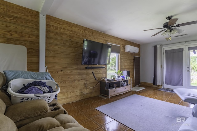 48851 Colt Run, Bay Minette, AL 36507 - living room with an AC wall unit, wood walls, ceiling fan, and tile patterned floors