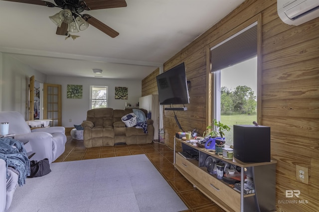 48851 Colt Run, Bay Minette, AL 36507 - living area featuring a wall unit AC, wood walls, and ceiling fan