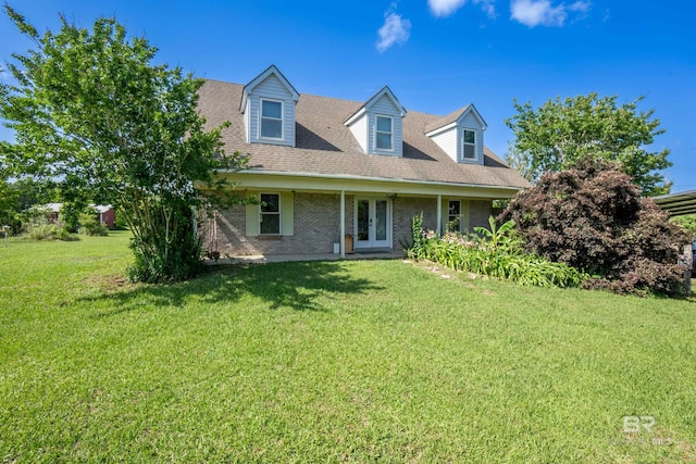 48851 Colt Run, Bay Minette, AL 36507 - cape cod home featuring french doors, a front lawn, and brick siding